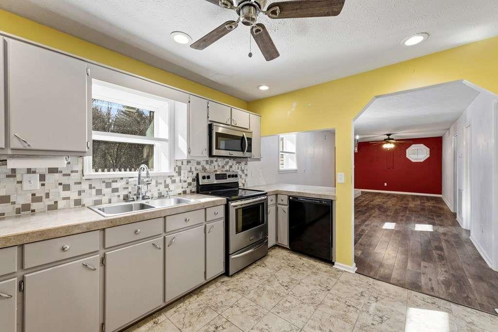 118 Jordan Road Blairsville, GA 30512 - Photo 16 of 49 a kitchen with a sink cabinets and window