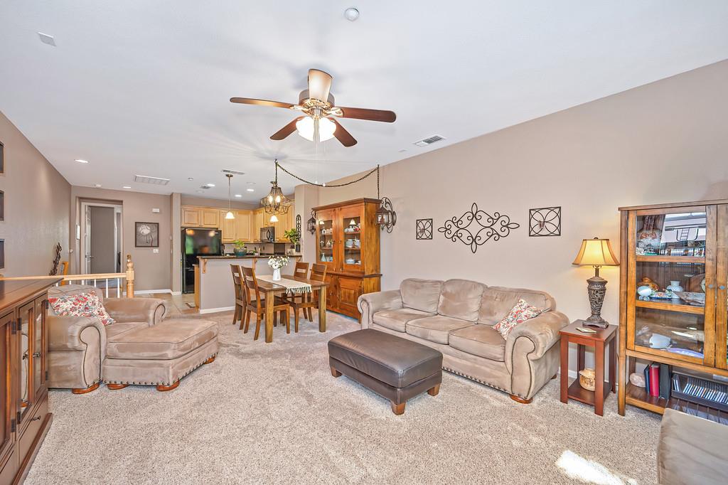 2603 Las Palomas Loop Lincoln, CA 95648 - Photo 8 of 22 a living room with furniture and a chandelier