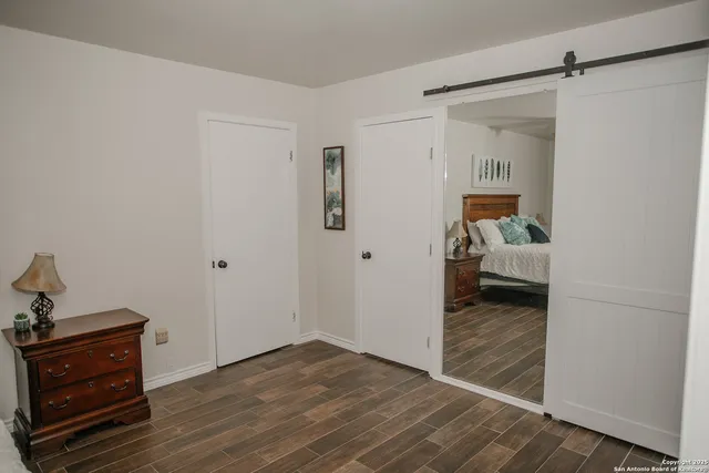 a view of a bedroom from the hallway