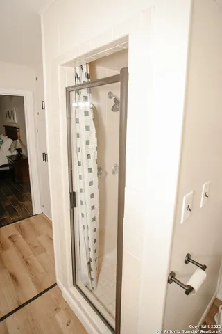 a view of a bathroom from a hallway
