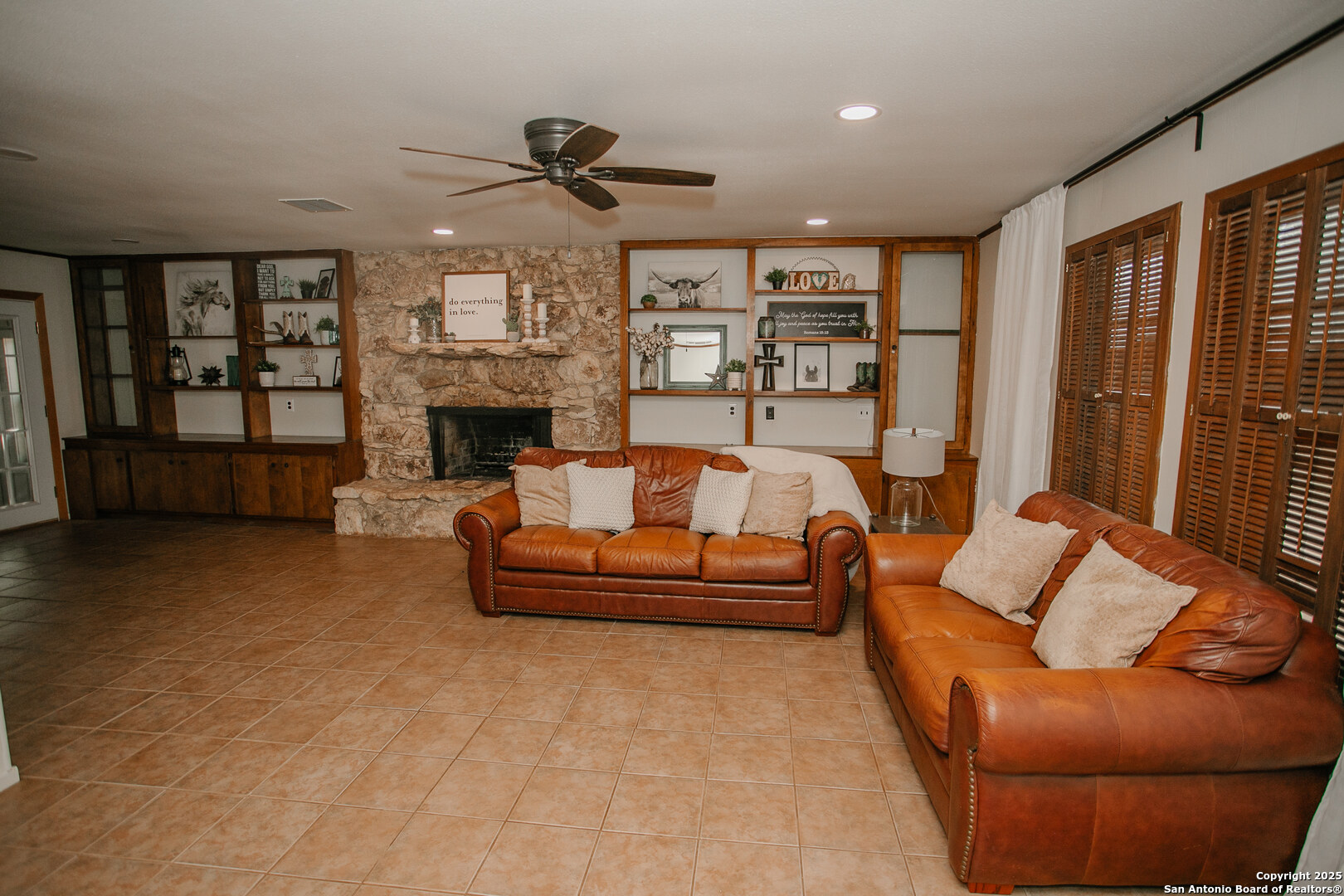 456 Margo Drive Pearsall, TX 78061 - Photo 25 of 40 a living room with furniture and a fireplace