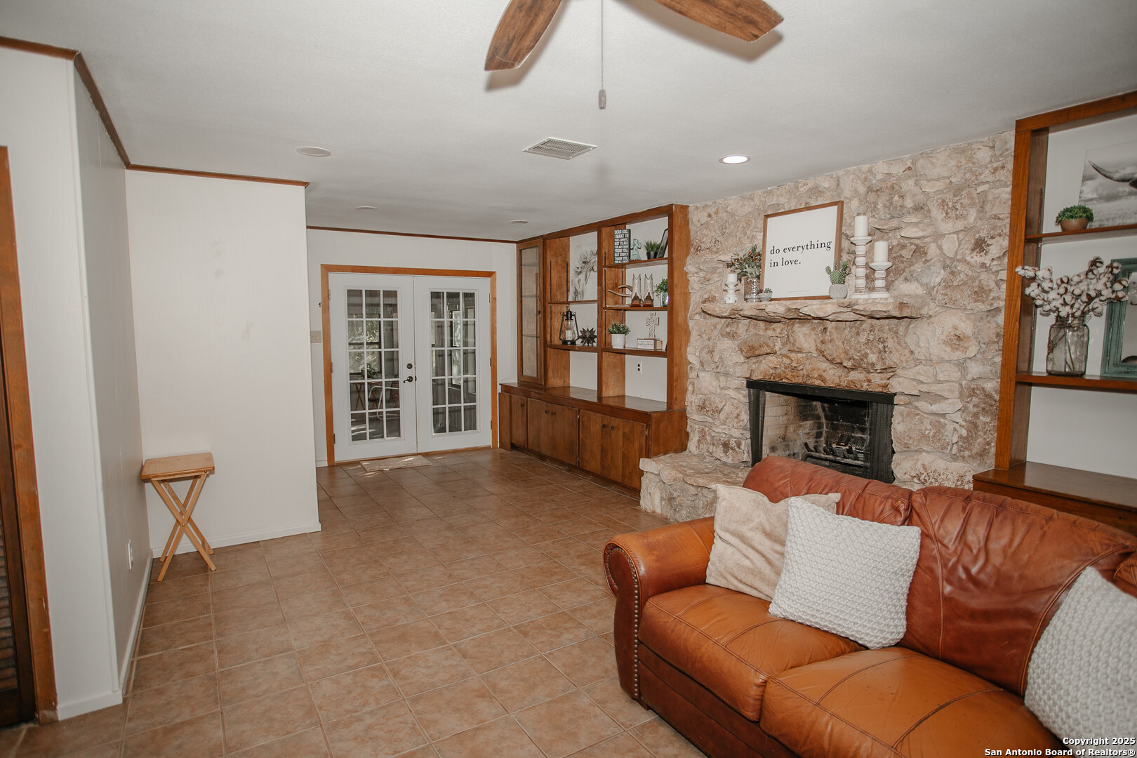 456 Margo Drive Pearsall, TX 78061 - Photo 26 of 40 a living room with furniture and a fireplace