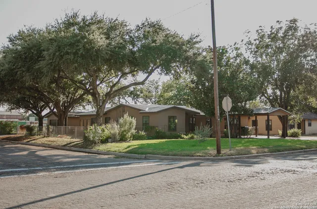 a house with trees in the background