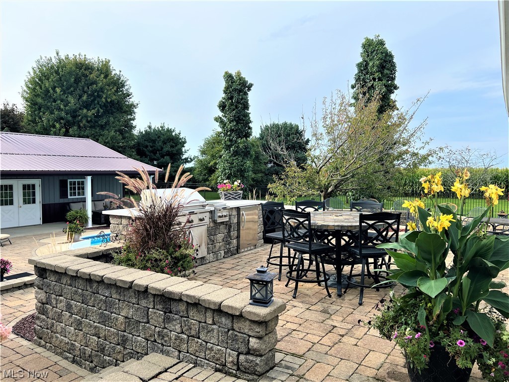 607 Bryan Road Milan, OH 44846 - Photo 23 of 34 View of patio featuring an outdoor kitchen