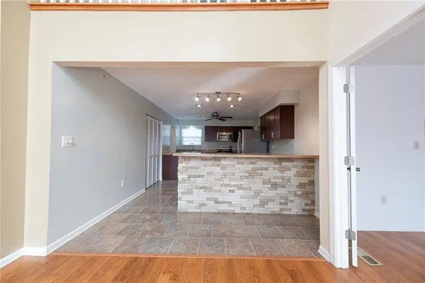 a view of kitchen with cabinets