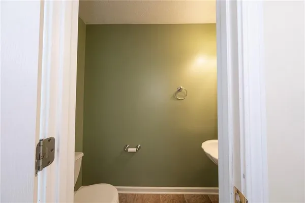 a bathroom with a granite countertop sink