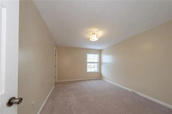a view of empty room with windows