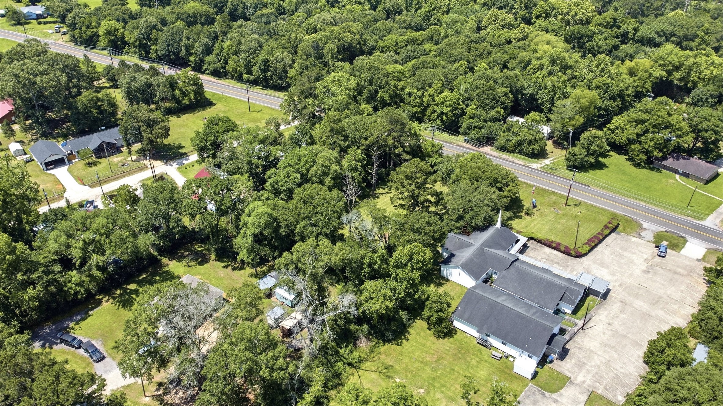 0 State Highway Loop Goodrich, TX 77335 - Photo 22 of 22 an aerial view of residential house with outdoor space and trees all around