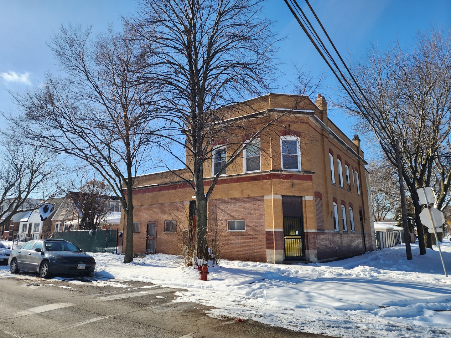 8900 South Normal Avenue Chicago, IL 60620 - Photo 1 of 28 a front view of a building with trees
