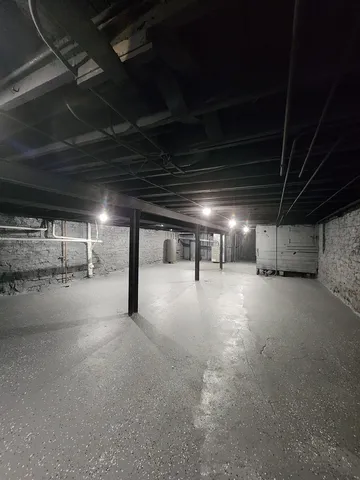 a view of empty room with wooden ceiling