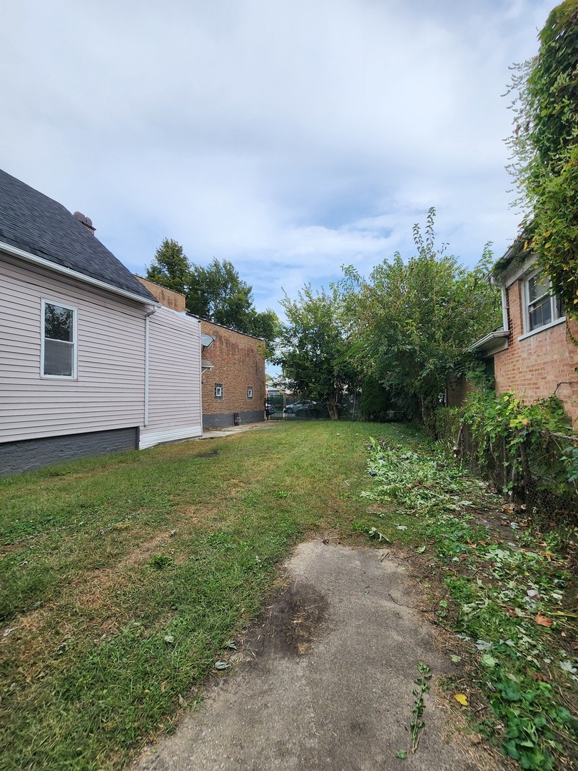 8900 South Normal Avenue Chicago, IL 60620 - Photo 27 of 28 a backyard of a house with lots of green space