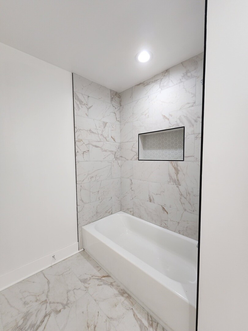 8900 South Normal Avenue Chicago, IL 60620 - Photo 6 of 28 a spacious bathroom with a bathtub