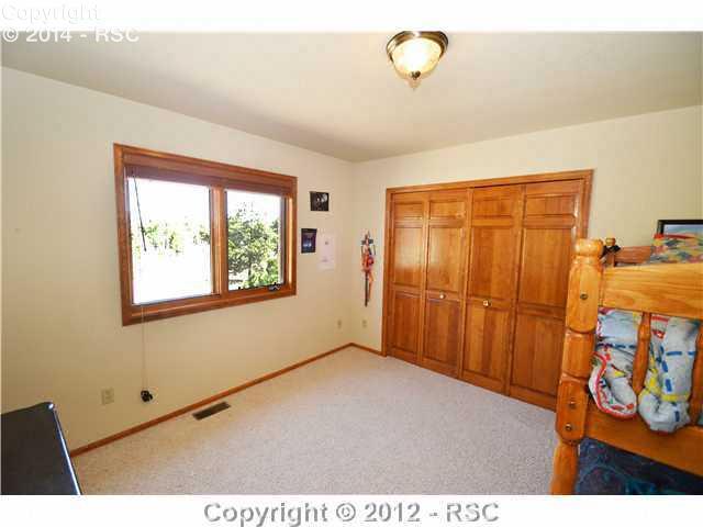8660 Shoup Road Colorado Springs, CO 80908 - Photo 11 of 16 ANOTHER BEDROOM ON THIS SAME LEVEL.