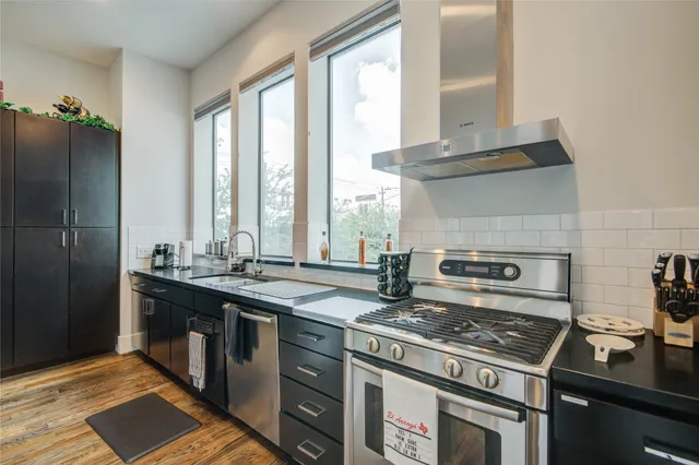 a kitchen with a stove and a sink