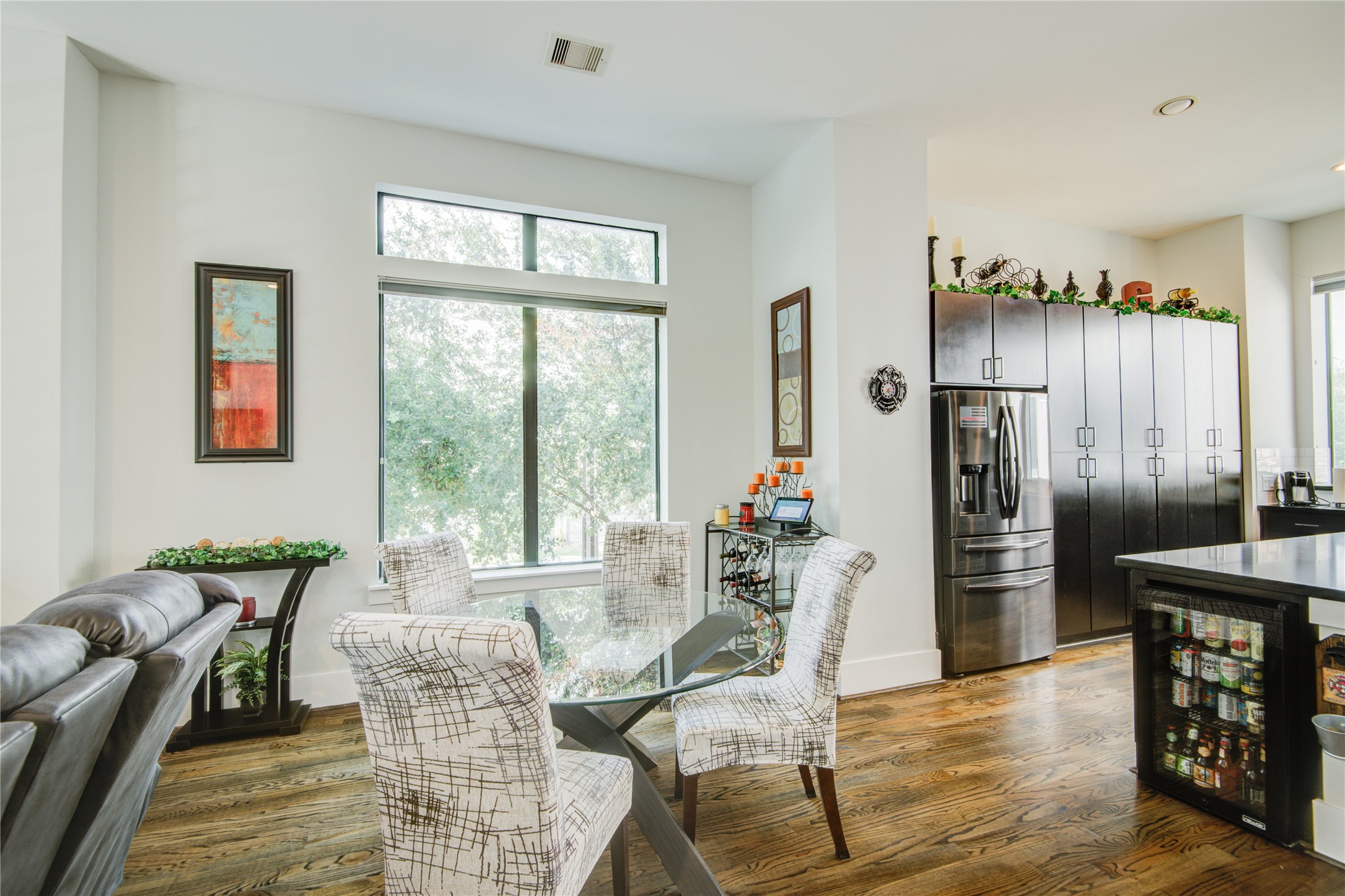 1401 Nagle Street Houston, TX 77003 - Photo 13 of 31 a living room with furniture a large window and a dining table