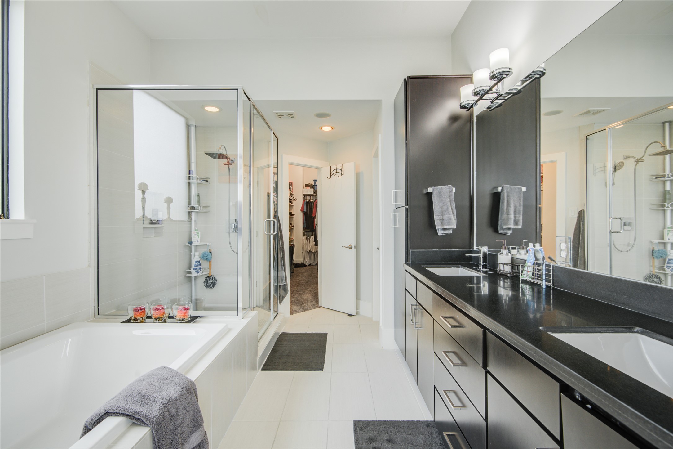 1401 Nagle Street Houston, TX 77003 - Photo 25 of 31 a spacious bathroom with a sink double vanity granite tub shower and mirror