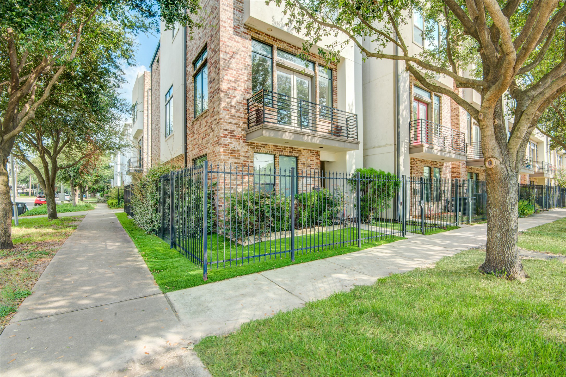 1401 Nagle Street Houston, TX 77003 - Photo 29 of 31 a view of a brick house with a yard and large trees