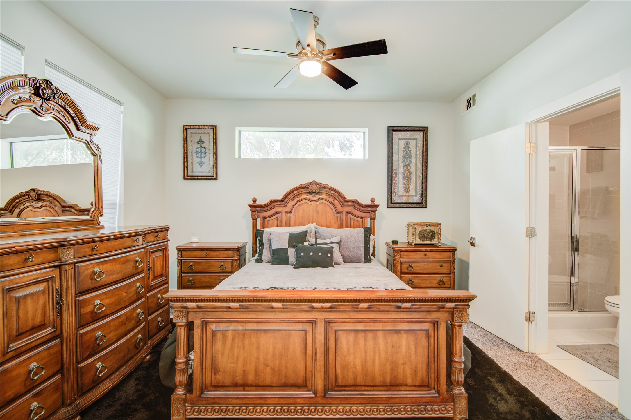 1401 Nagle Street Houston, TX 77003 - Photo 3 of 31 a bedroom with a bed and a chandelier