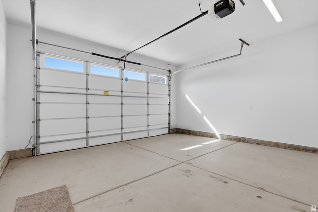 677 East 800 S Street Springville, UT 84663 - Photo 16 of 35 Garage featuring a garage door opener and baseboards