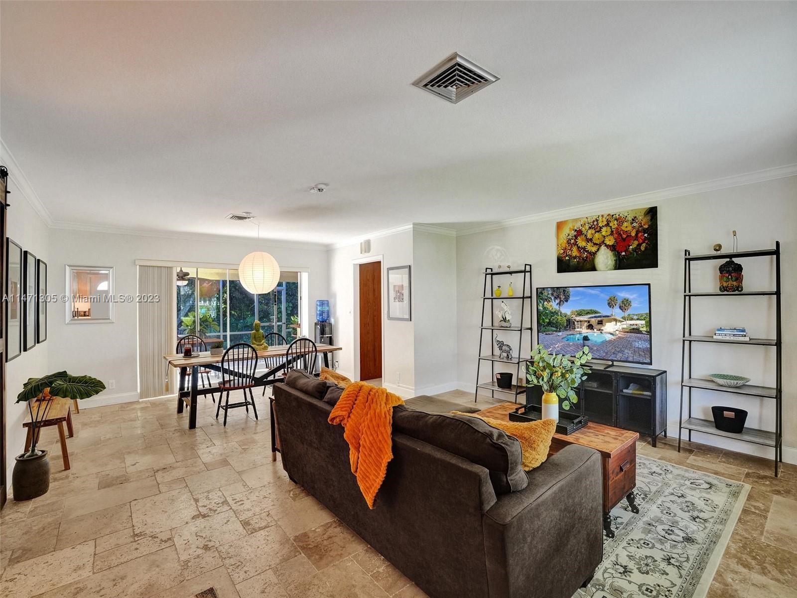 2028 South Conference Drive Boca Raton, FL 33486 - Photo 2 of 62 a living room with furniture and a flat screen tv