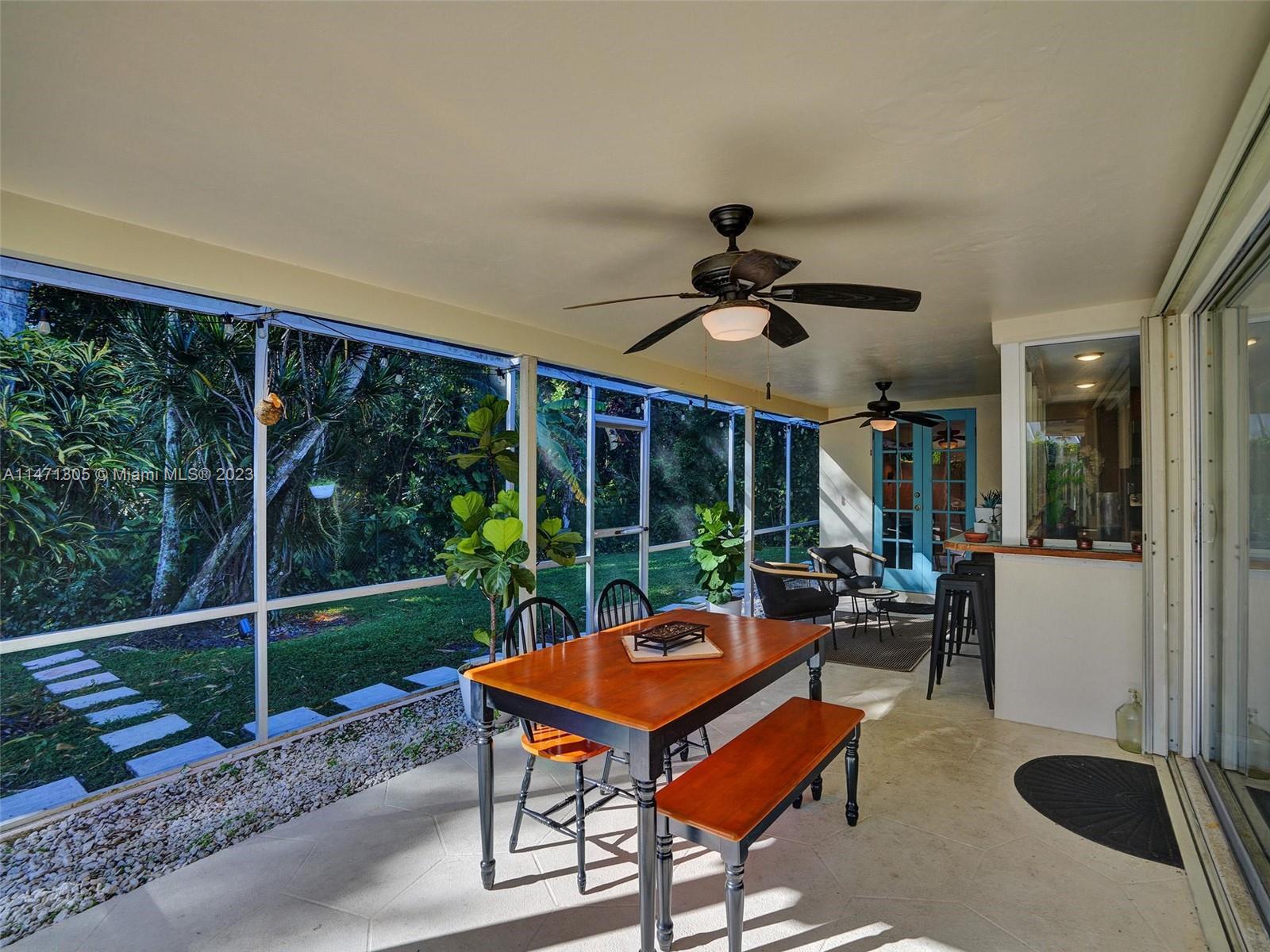 2028 South Conference Drive Boca Raton, FL 33486 - Photo 30 of 62 a view of a patio with a backyard table and chairs