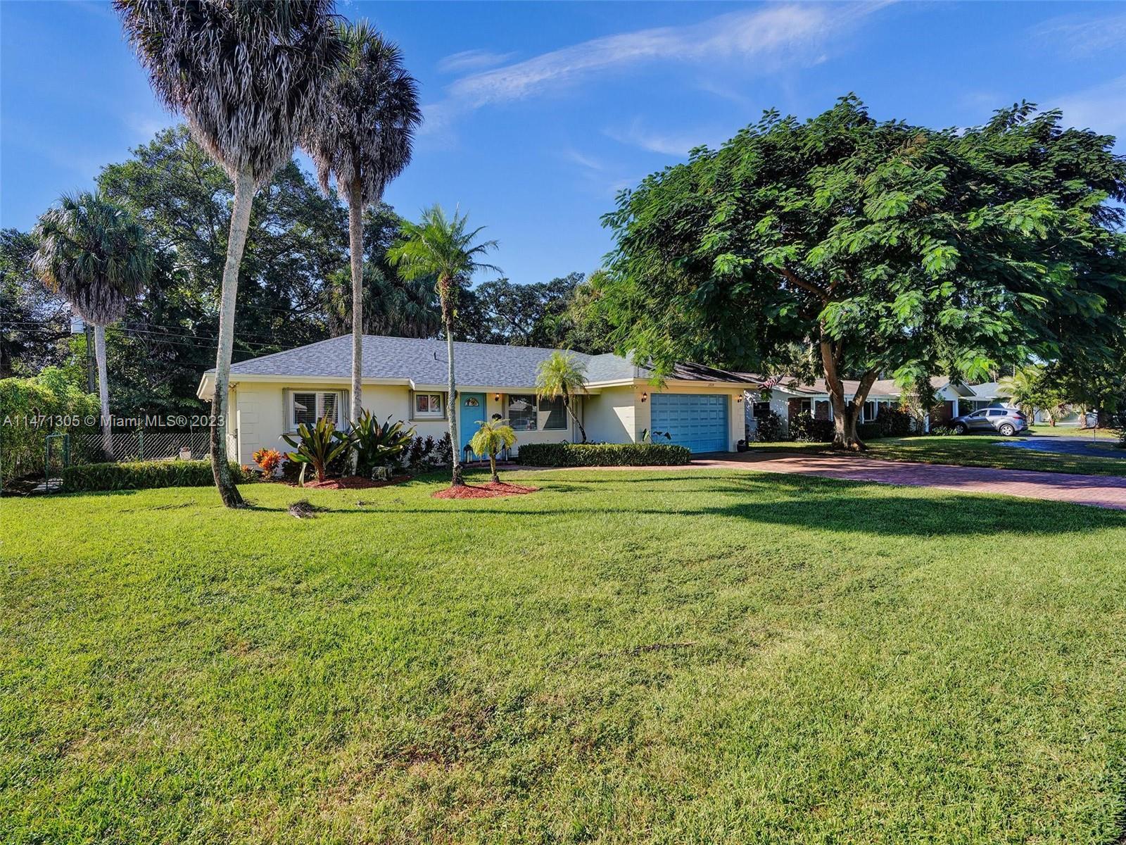 2028 South Conference Drive Boca Raton, FL 33486 - Photo 43 of 62 a front view of a house with garden