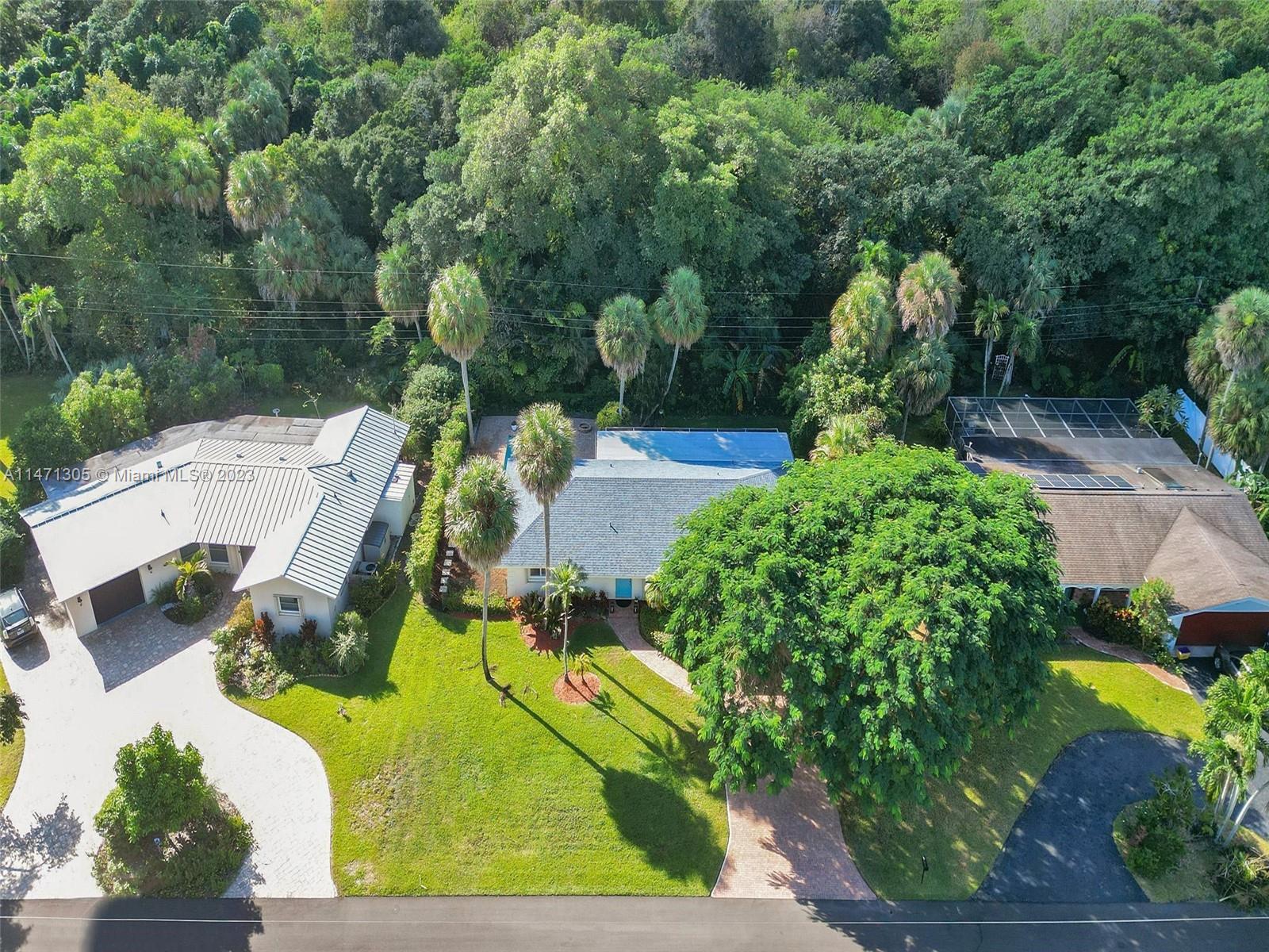 2028 South Conference Drive Boca Raton, FL 33486 - Photo 45 of 62 an aerial view of a swimming pool with a yard