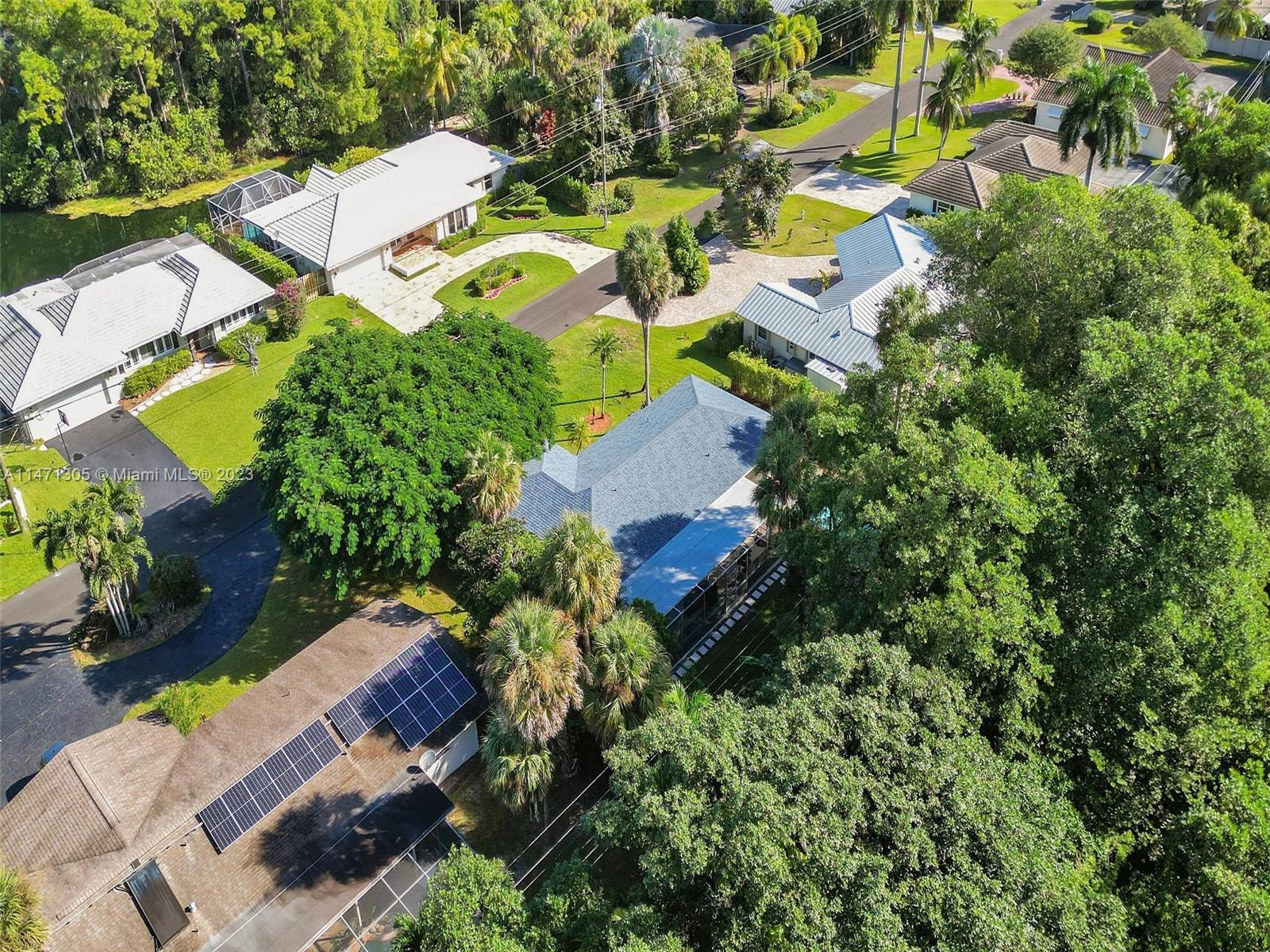 2028 South Conference Drive Boca Raton, FL 33486 - Photo 49 of 62 an aerial view of residential house with outdoor space and trees all around