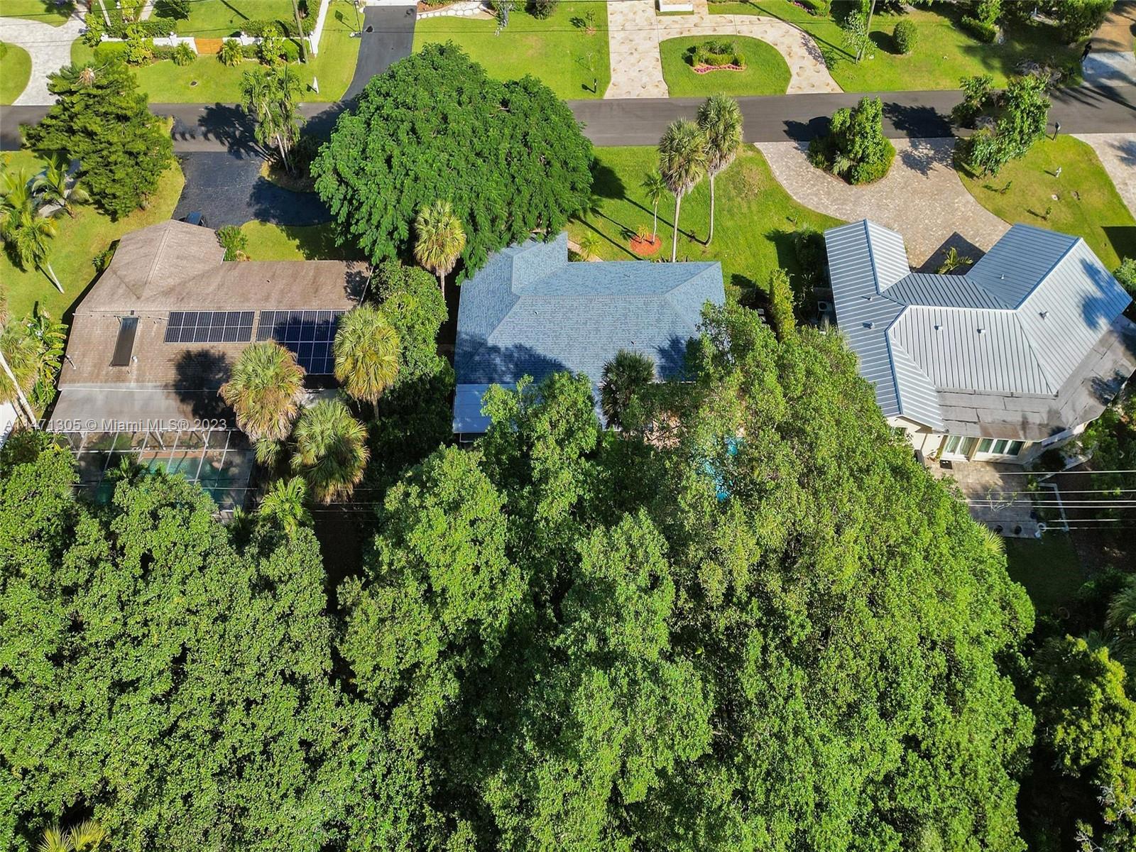 2028 South Conference Drive Boca Raton, FL 33486 - Photo 50 of 62 an aerial view of residential house with outdoor space and trees all around