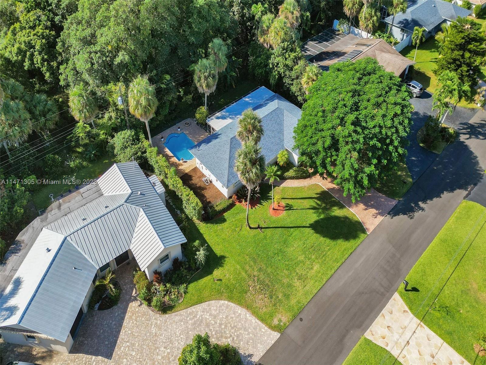 2028 South Conference Drive Boca Raton, FL 33486 - Photo 53 of 62 an aerial view of a house with a yard and tennis court