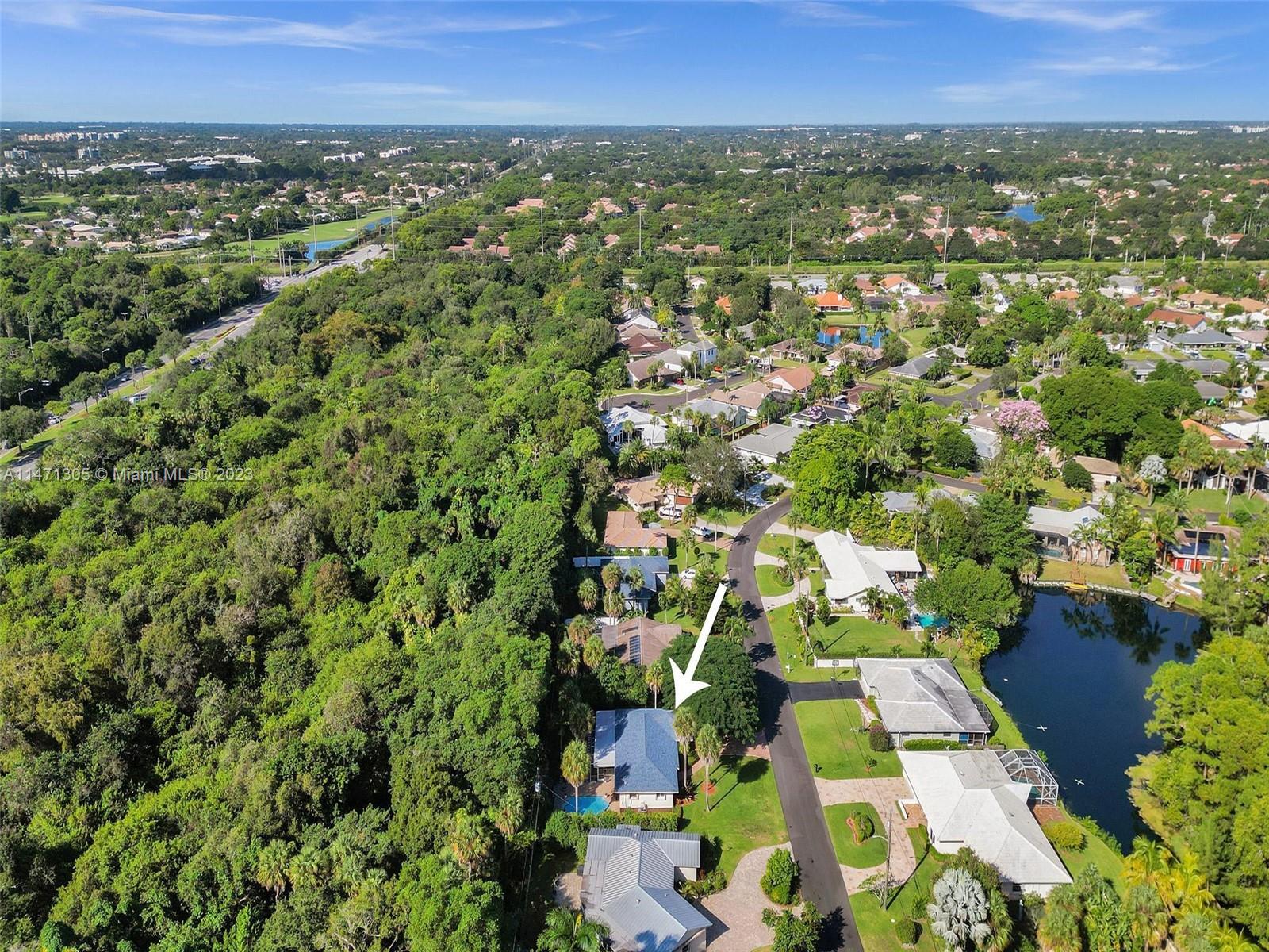 2028 South Conference Drive Boca Raton, FL 33486 - Photo 61 of 62 an aerial view of residential houses with outdoor space and trees