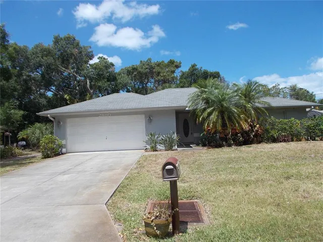 a front view of a house with yard