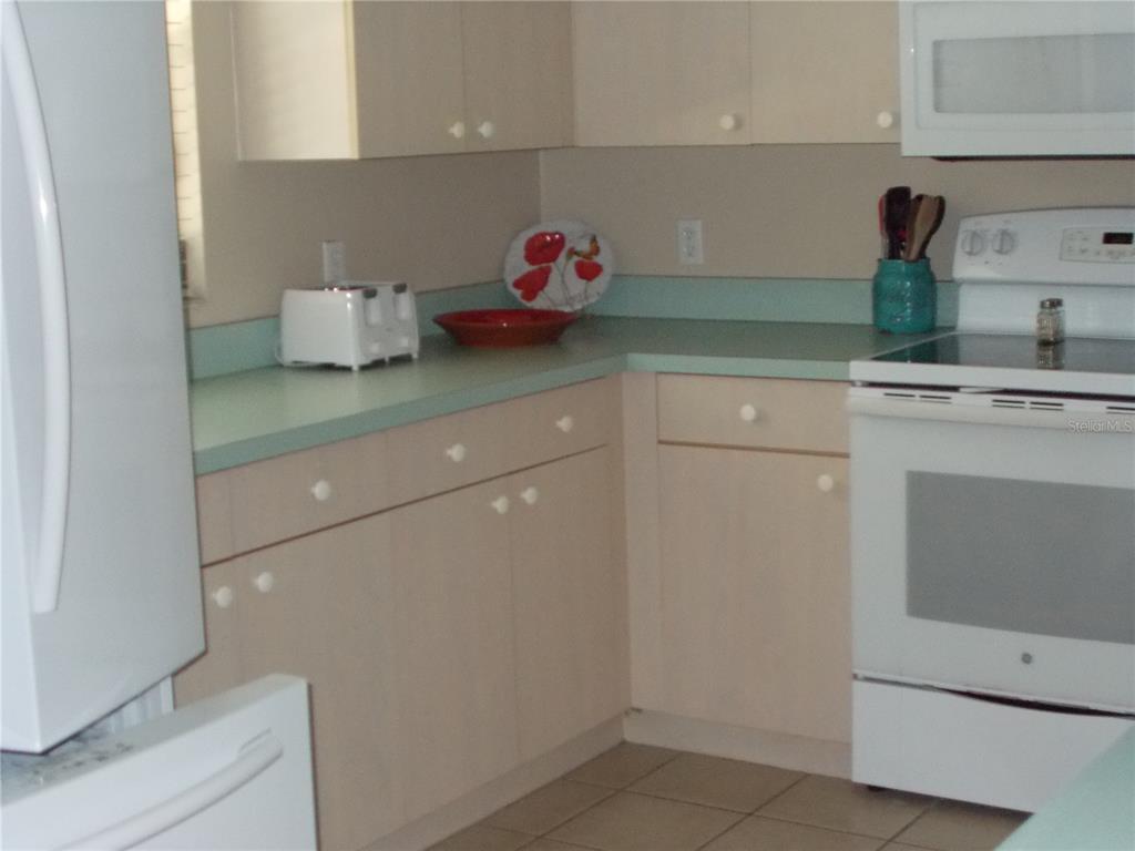 2880 Geneva Road Venice, FL 34293 - Photo 19 of 19 a kitchen with a sink and cabinets