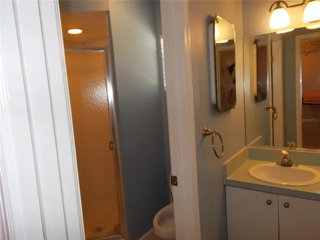 a room with hard wood floors and a window