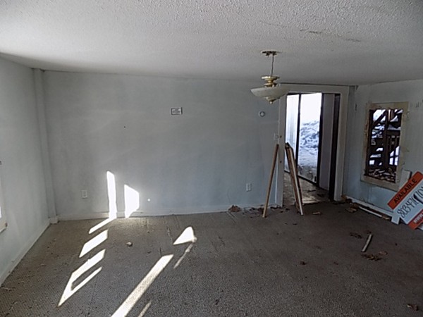 13 Basket Street Huntington, MA 01050 - Photo 2 of 18 wooden floor and windows in a room