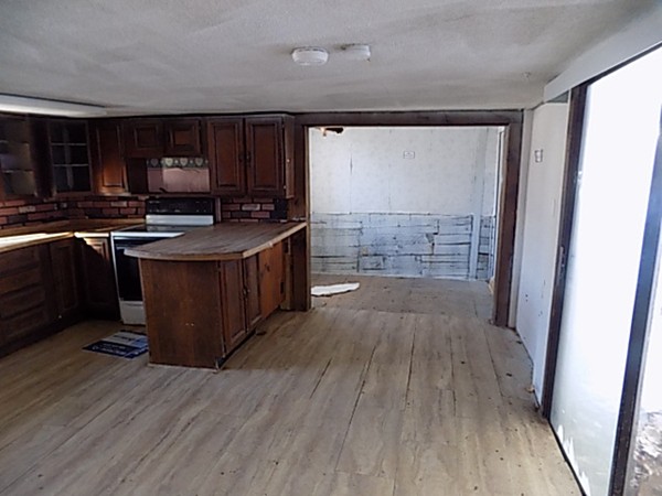13 Basket Street Huntington, MA 01050 - Photo 4 of 18 a kitchen with stainless steel appliances granite countertop a stove and a wooden floors