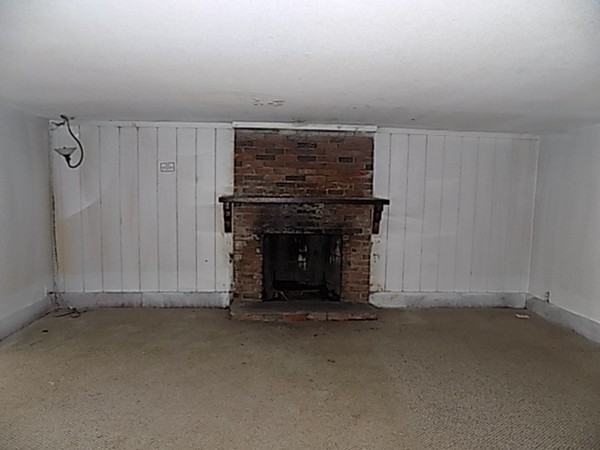13 Basket Street Huntington, MA 01050 - Photo 10 of 18 an empty room with a fireplace