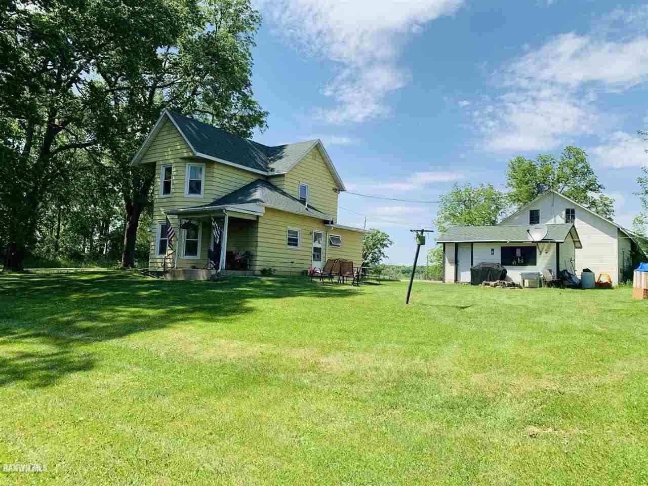 2985 North AYP Road Lena, IL 61048 - Photo 4 of 5 a front view of a house with a yard and trees