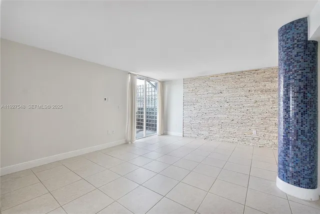 a view of an empty room and window