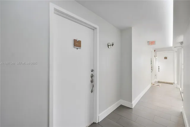 a view of a hallway with two rooms