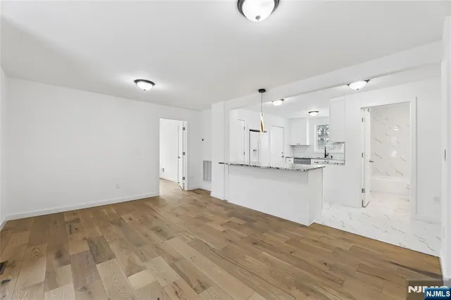 a view of kitchen with wooden floor