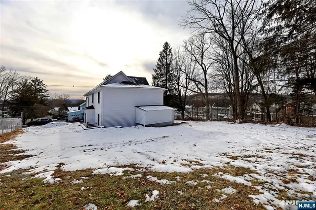 a view of a backyard with snow