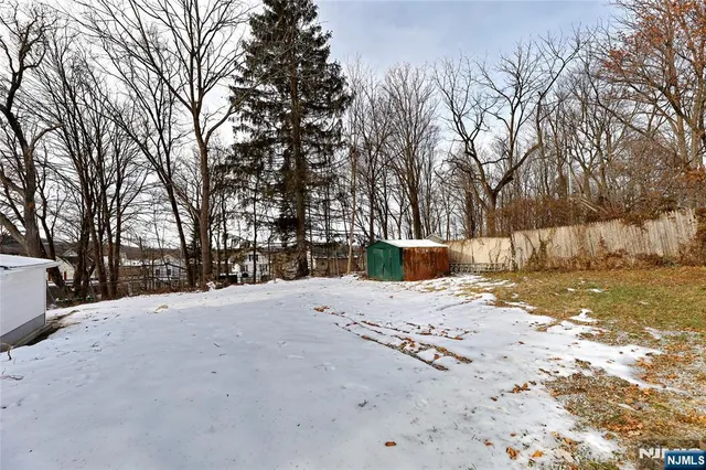 a view of a backyard of the house