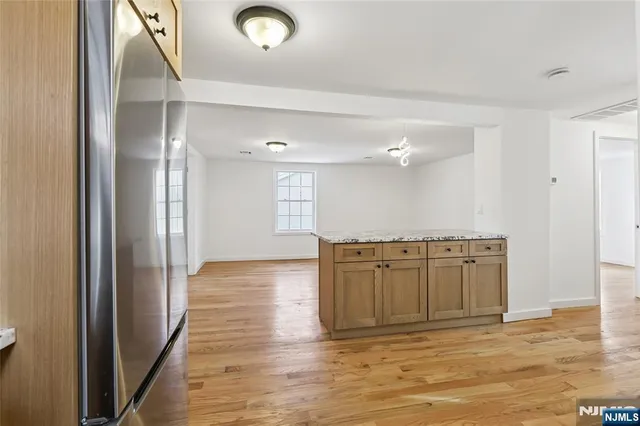 a view of a livingroom with wooden floor