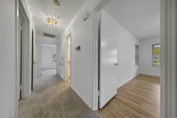 a view of empty room with windows