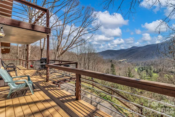 a view of balcony with wooden floor