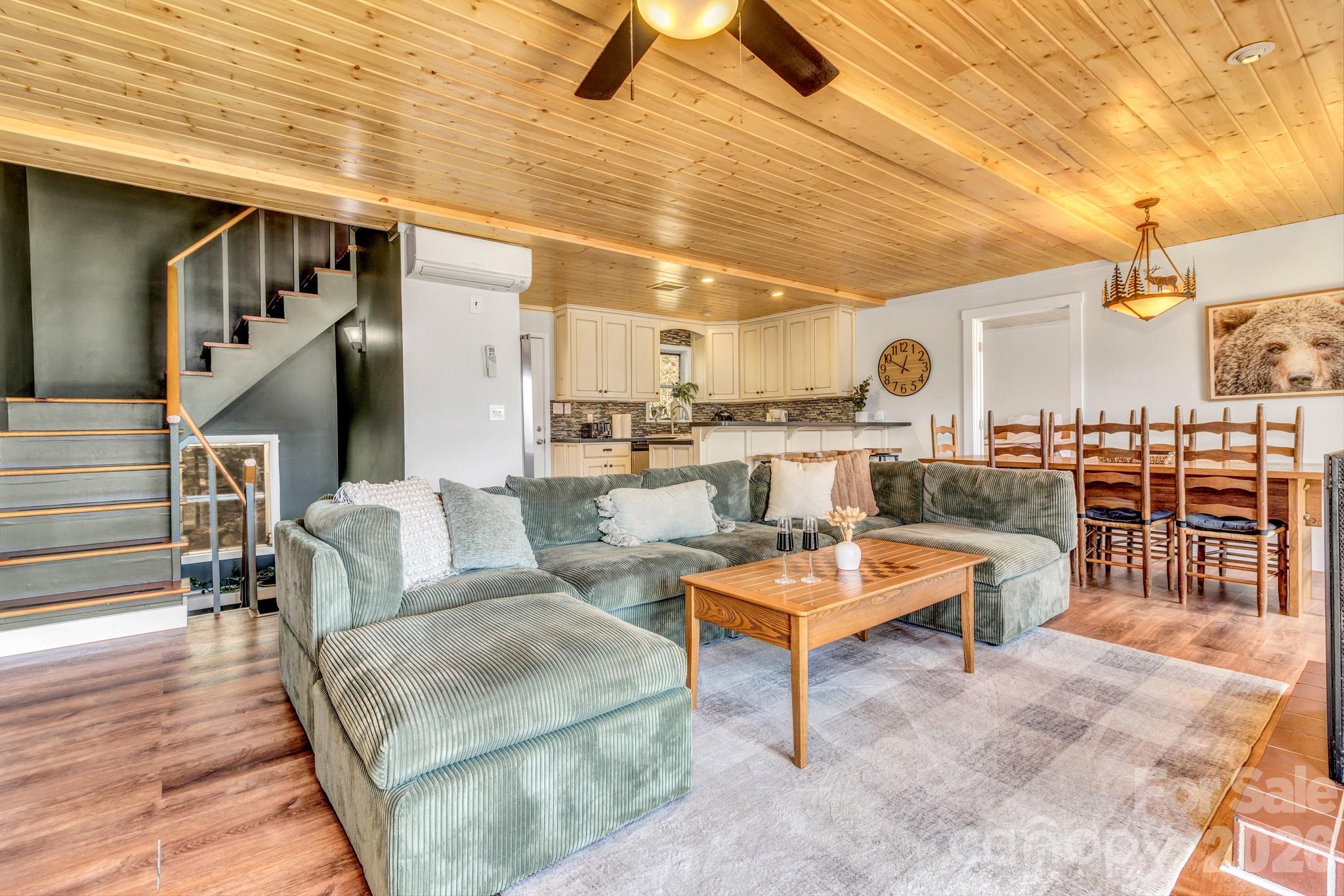 80 Hidden Falls Road Maggie Valley, NC 28751 - Photo 14 of 47 a living room with lots of furniture and a rug