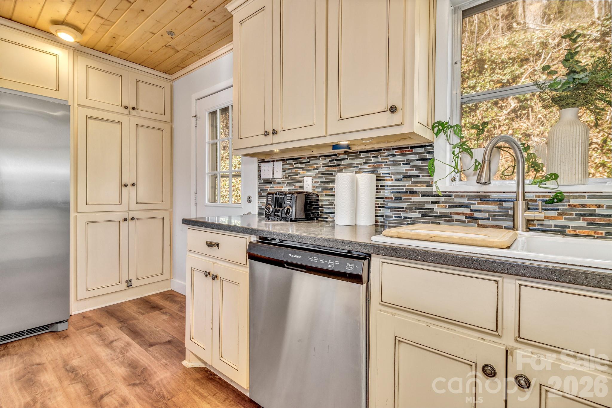80 Hidden Falls Road Maggie Valley, NC 28751 - Photo 24 of 47 a kitchen with stainless steel appliances granite countertop a sink and a cabinets