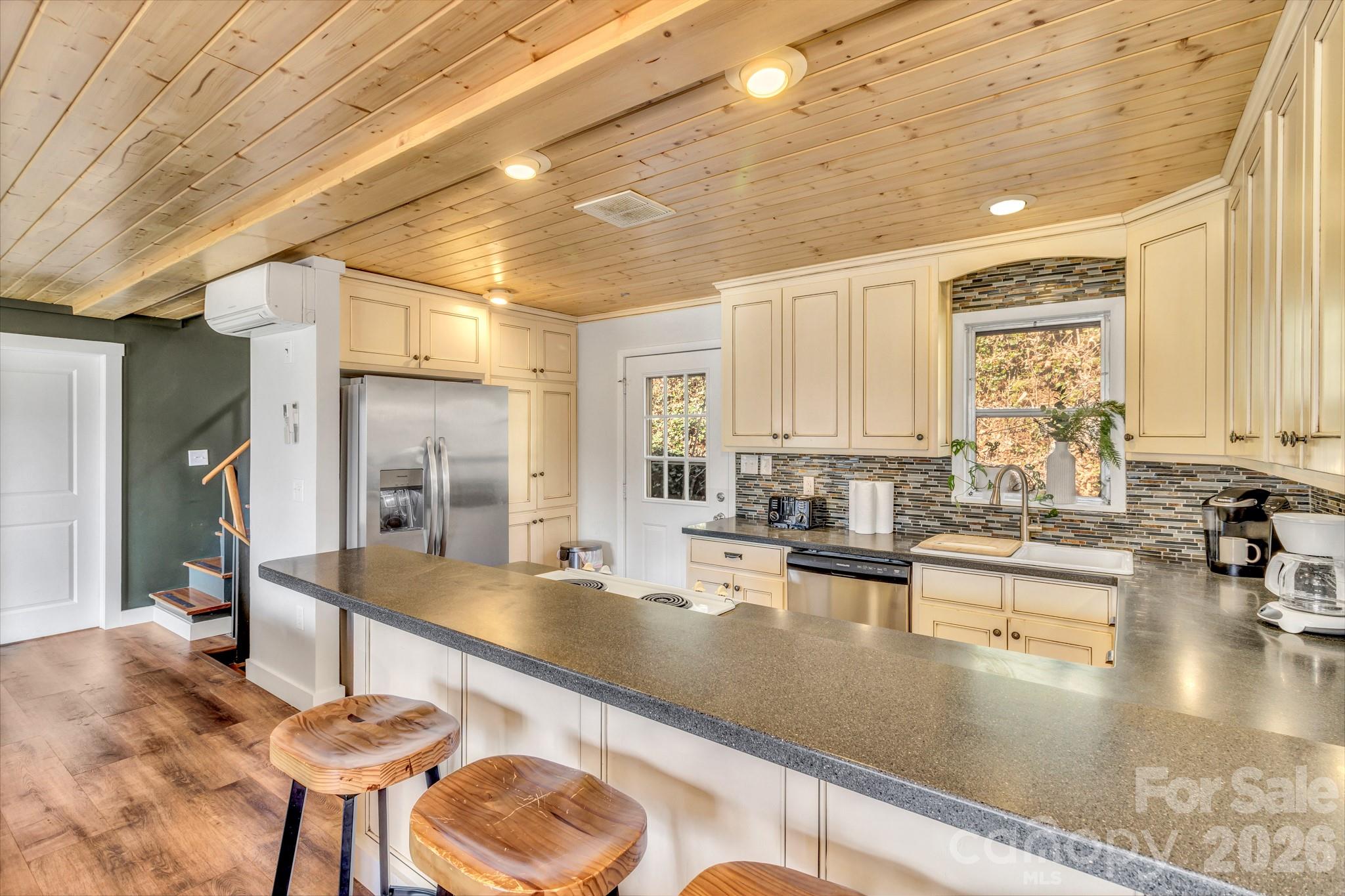 80 Hidden Falls Road Maggie Valley, NC 28751 - Photo 25 of 47 a kitchen with stainless steel appliances granite countertop a sink and a counter space