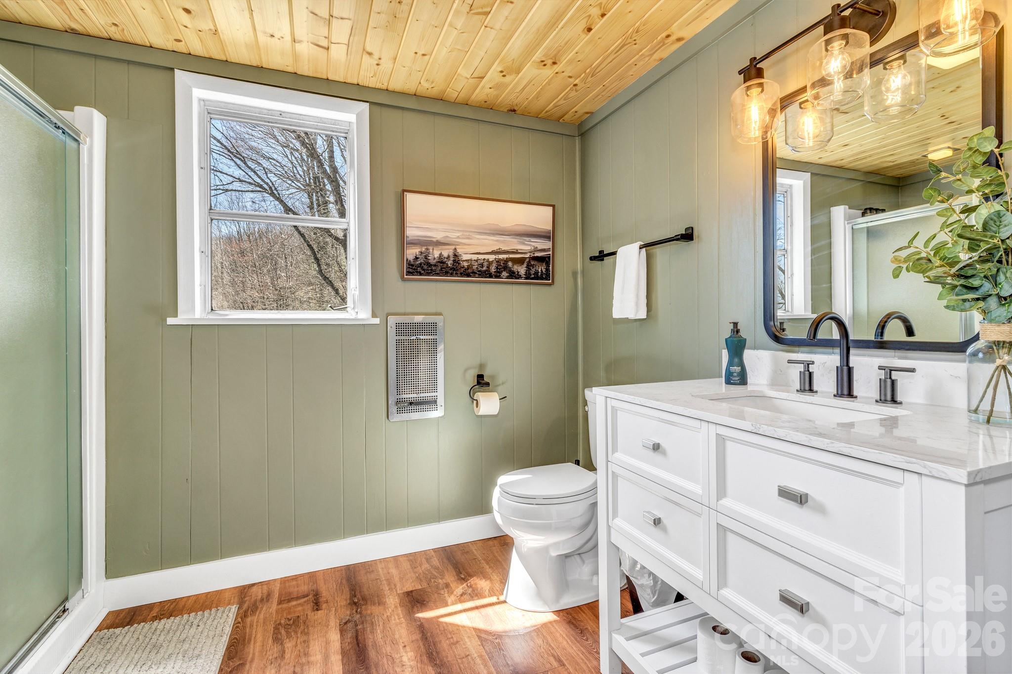 80 Hidden Falls Road Maggie Valley, NC 28751 - Photo 38 of 47 a bathroom with a granite countertop toilet sink and mirror